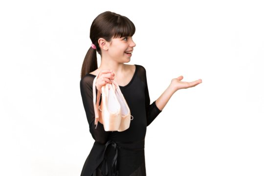 Little caucasian girl practicing ballet over isolated background with surprise expression while looking side