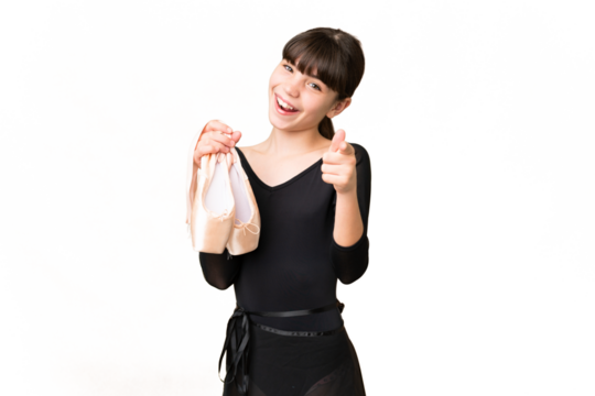 Little caucasian girl practicing ballet over isolated background pointing front with happy expression