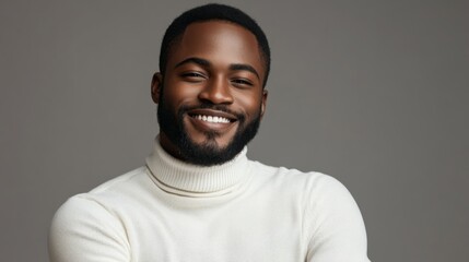 Obraz premium Portrait of a smiling man in a white turtleneck