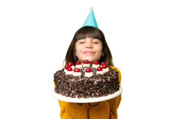 Little girl holding birthday cake over isolated chroma key background