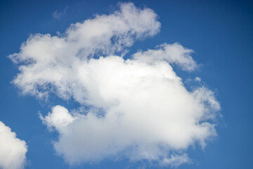 Cloud formation resembling the letter S, symbolizing creativity, nature's patterns, and imagination
