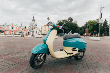 Retro-Style Turquoise and Beige Scooter – Vintage Vibes Photo