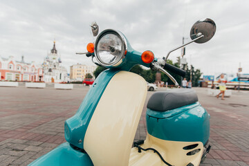 Retro-Style Turquoise and Beige Scooter – Vintage Vibes Photo