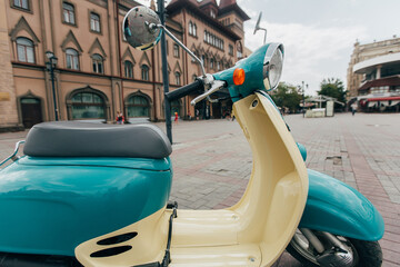Retro-Style Turquoise and Beige Scooter – Vintage Vibes Photo