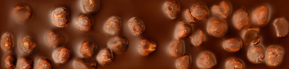 Chocolate bar textured background. Milk chocolate  texture with nuts. Pattern. Wallpaper