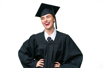 Young university graduate  caucasian woman over isolated background posing with arms at hip and smiling