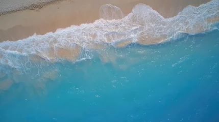 Fotobehang Aerial view of turquoise ocean waves lapping on sandy shore © Thanawat_Suesoypan