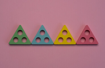 Obraz premium four triangles on a pink background. The concept