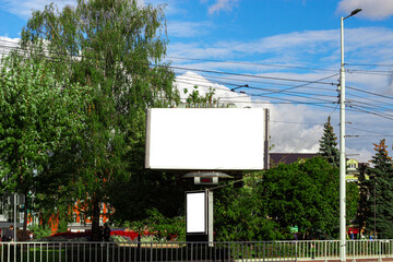 Horizontal blank white street billboard in the city. Advertising banner with copy space. Mock up
