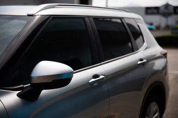 Naklejka premium silver car wagon suv parked petrol station tinted windows