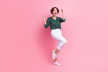 Full body photo of impressed ecstatic girl dressed stylish shirt white pants scream yeah win lottery isolated on pink color background