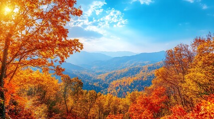 Fototapeta premium A scenic view of a mountain covered in trees of golden, orange, and red leaves with a clear blue sky.