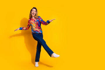 Photo portrait of young funny blonde hair adorable woman energetic training her dance isolated on yellow color background