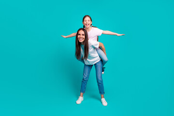 Photo of charming optimistic girl with mommy wear white trendy clothes isolated on cyan color background