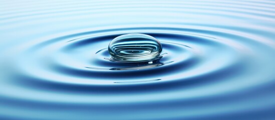 Water Drop Ripples on Calm Blue Surface