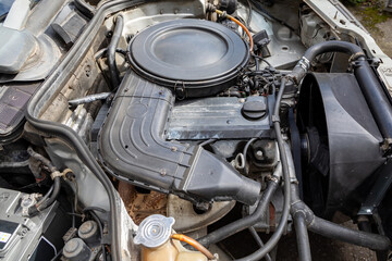 Repair of the car engine and its components in a special car service.