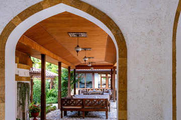 The veranda of the cafe with tables in oriental style.