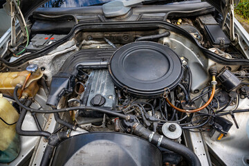 Repair of the car engine and its components in a special car service.