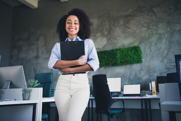 Photo of sweet charming lady assistant wear shirt holding documents indoors workplace workstation