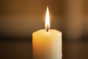 Close-up of a burning candle, shallow depth of field