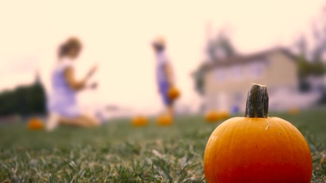 Mother taking a cell phone photo of son at fall festival - Orange Tint