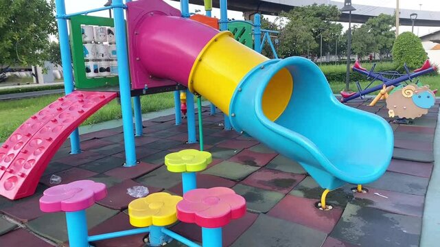 A video showcasing an outdoor playground, featuring a spacious open area with fresh air, bathed in the soft light of a peaceful morning atmosphere