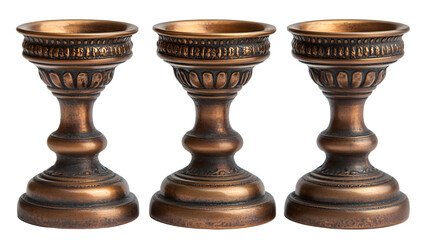 a group of bronze candlesticks. 