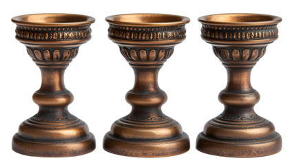 a group of bronze candlesticks. 