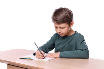 Boy with correct posture and notebook at wooden desk on white background