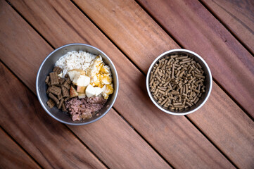 Top view of two bowls with dog food in them