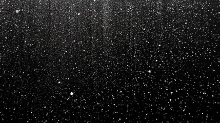 Obraz premium Tiny White Dots in Dense Rain Against Black Background