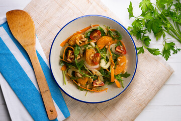 Healthy green fennel and mandarin salad. Top view table with  decorations.