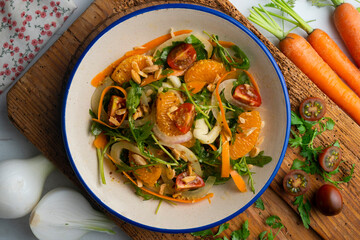 Healthy green fennel and mandarin salad. Top view table with  decorations.