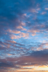 Sunset sky background, beautiful sunset sky view. Vast panoramic sunset sky with dramatic colorful clouds