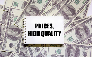 On a notepad the text prices, high quality, Dollars lie on a white background, Financial concept, Quality, service, customer satisfaction