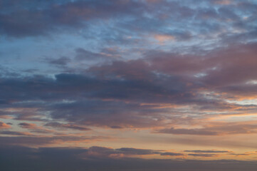 Sunset sky background. Dramatic evening sunset sky in vivid colors, wide panoramic sunset sky background