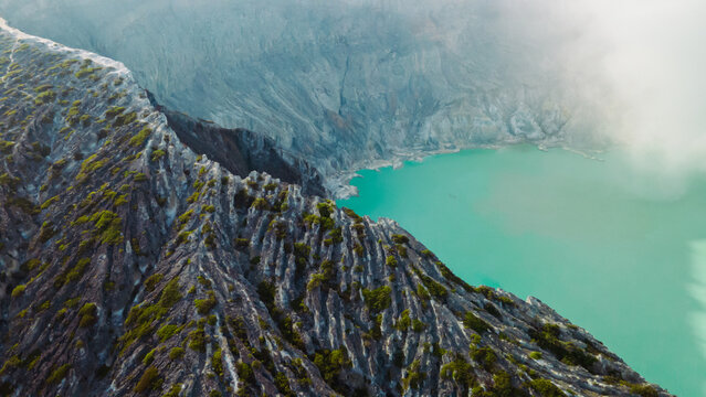 Aerial view of the turquoise sulfur lake at Kawah Ijen volcano in East Java, Indonesia.
