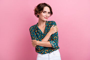 Obraz premium Photo of cute pretty girl with bob hairstyle dressed stylish shirt embrace herself touch fresh clothes isolated on pink color background