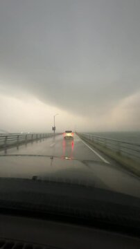 Chesapeake Bay Bridge Tunnel, Chesapeake Bay, Virginia, USA - Driving over the Chesapeake Bay Bridge Tunnel while the remnants of Hurricane Helene whip up the waves, blow wind and a shelf cloud