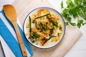 Grilled swordfish with green asparagus. Top view table with  decorations.