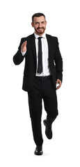 Young businessman in suit running on white background