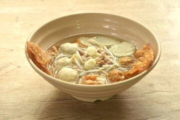 boiled Hakka meatball made fish and shrimp with bean sprout and lettuce in spicy soup on bowl  