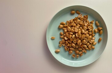 fried peanuts on a plate on a white background