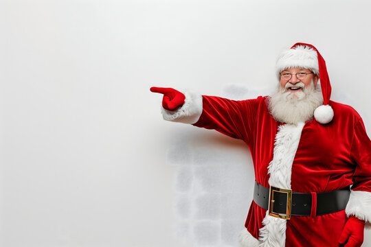 Christmas advertising. Santa claus points pinger towards empty space. High quality photo