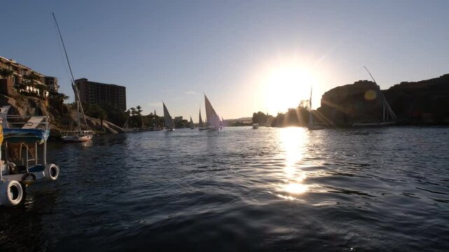 09/02/2024 ,Aswan Egypt, Tourist boats float on the Nile River, at Aswan Egypt