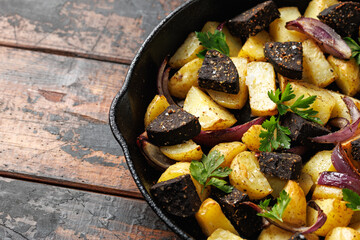 Black pudding or blood sausage warm salad with vegetables