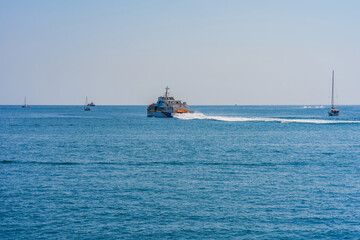 Passenger ferry and small boats on Valletta Grand Harbour, Malta.