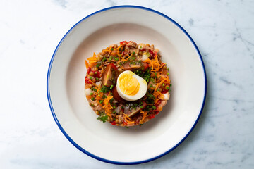 Healthy lentil salad with tuna and hard-boiled egg. Top view table with  decorations.
