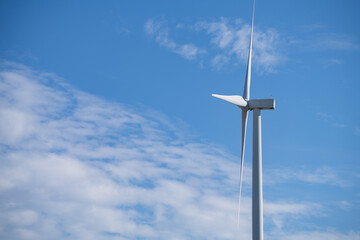 Wind turbines against blue sky, Wind energy. Wind power. Sustainable, renewable energy. Wind turbine generate electricity. Sustainable resources. Green technology for energy sustainability.