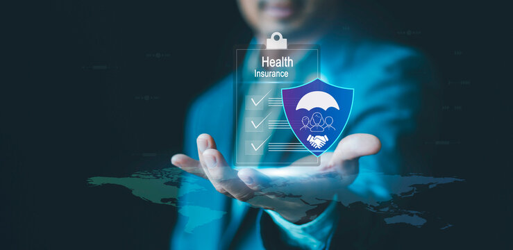 Health insurance concept. businessman holding virtual graphic insurance form and healthcare medical icon, access to welfare health, medical health and life, accident and logistics insurance - Powered by Adobe